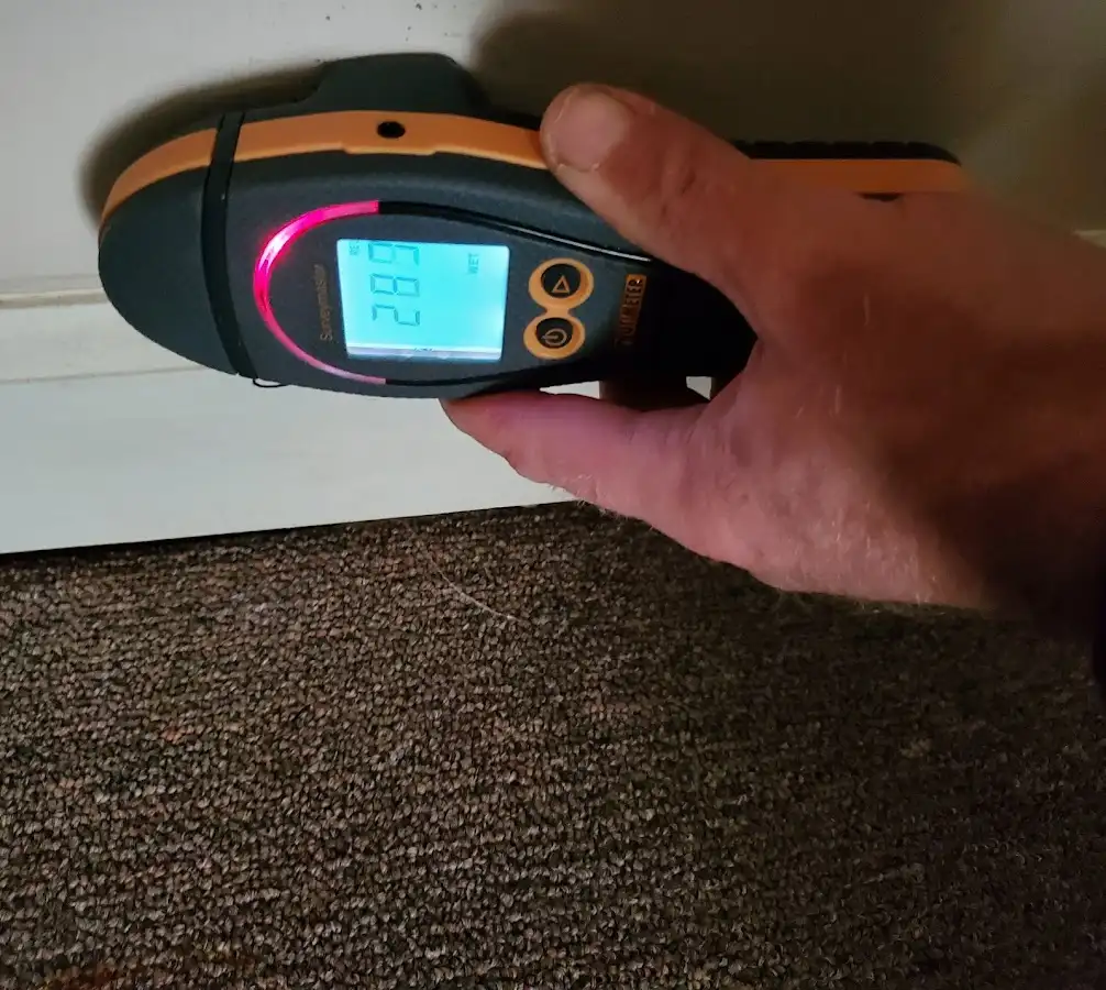 Moisture detection at baseboard during Storm Damage Restoration in Oshkosh